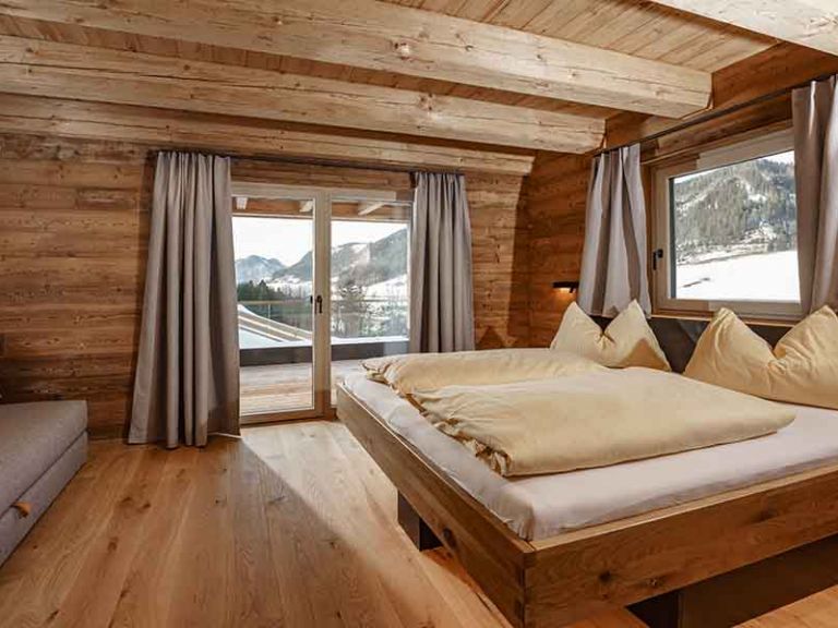 Genießen Sie Ihren ganz persönlichen Luxusurlaub im Chalet Gemütliches Schlafzimmer im Chalet